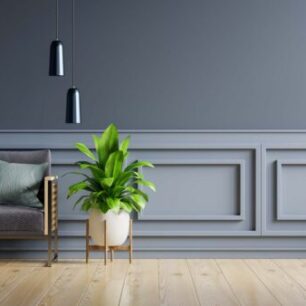 Mockup living room interior with sofa on empty dark blue wall background.3d rendering